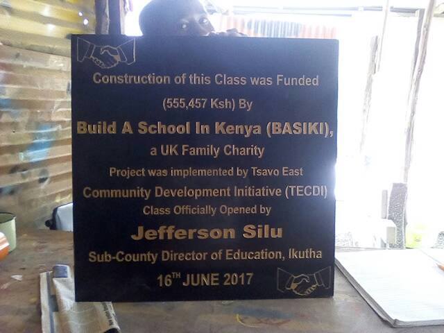 A commemorative plaque announcing the completion of a new classroom