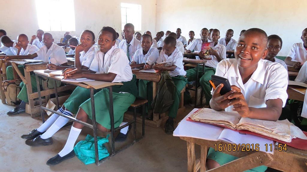 Students in a classroom funded by BASIK